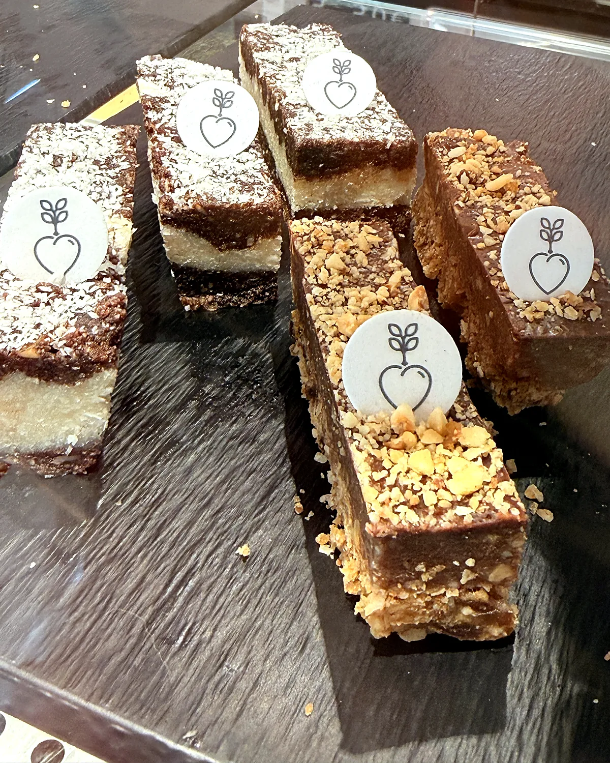 Layered bars on slate in the shop, each with a heart