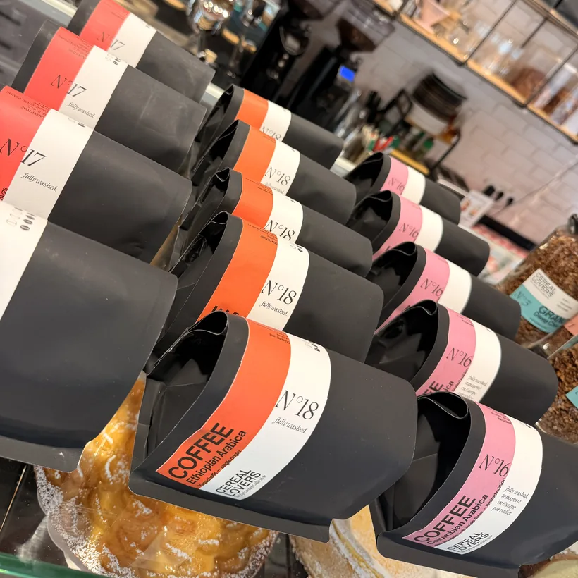 Rows of N°16, N°17 and N°18 coffee bags lined up on the counter