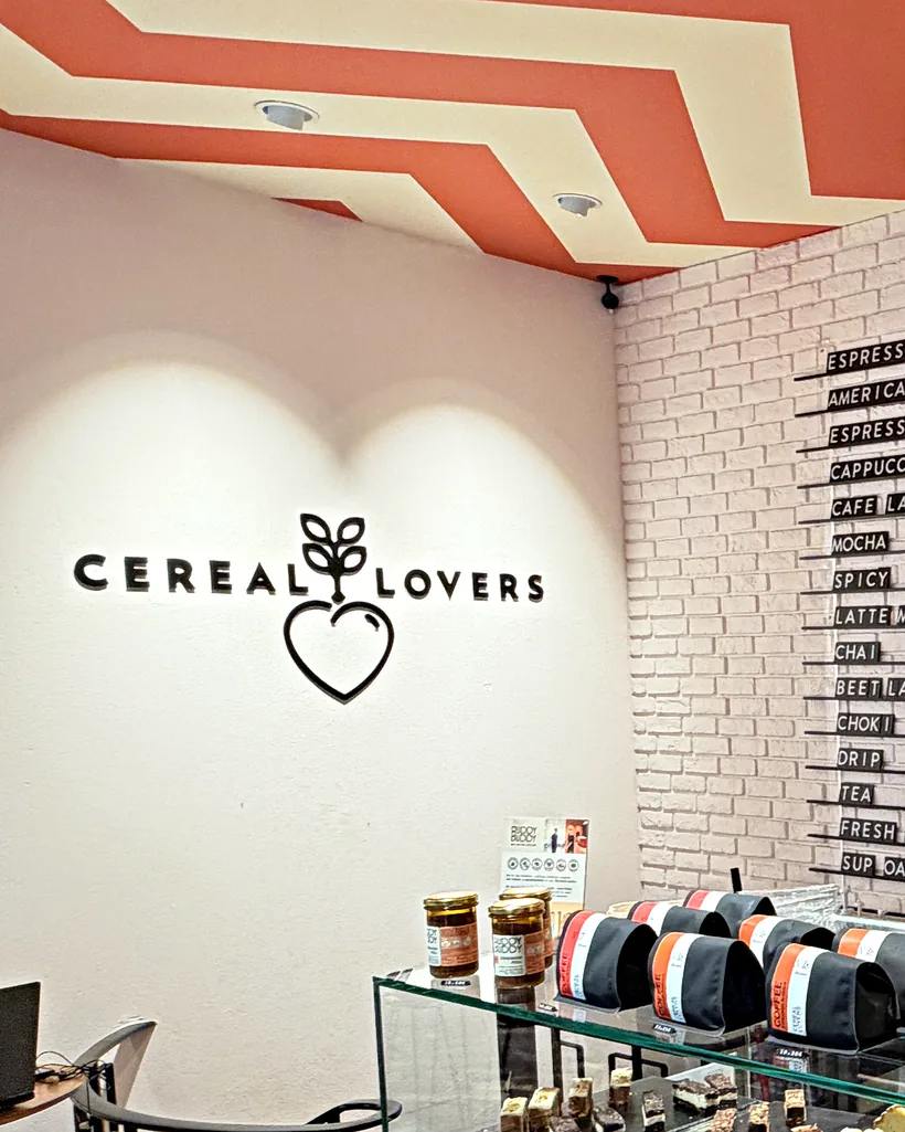 The heart logo on the wall under the red and white zigzag ceiling