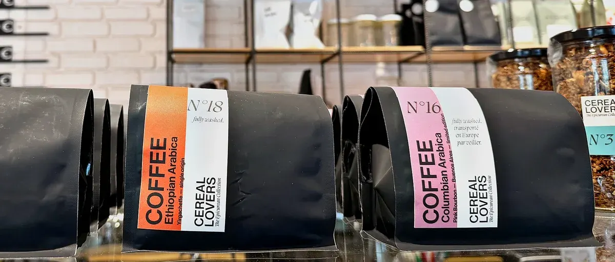 The three coffees on the shelf in the shop